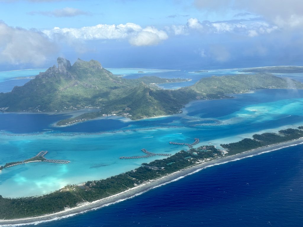 Flying in overhead view of Bora Bora